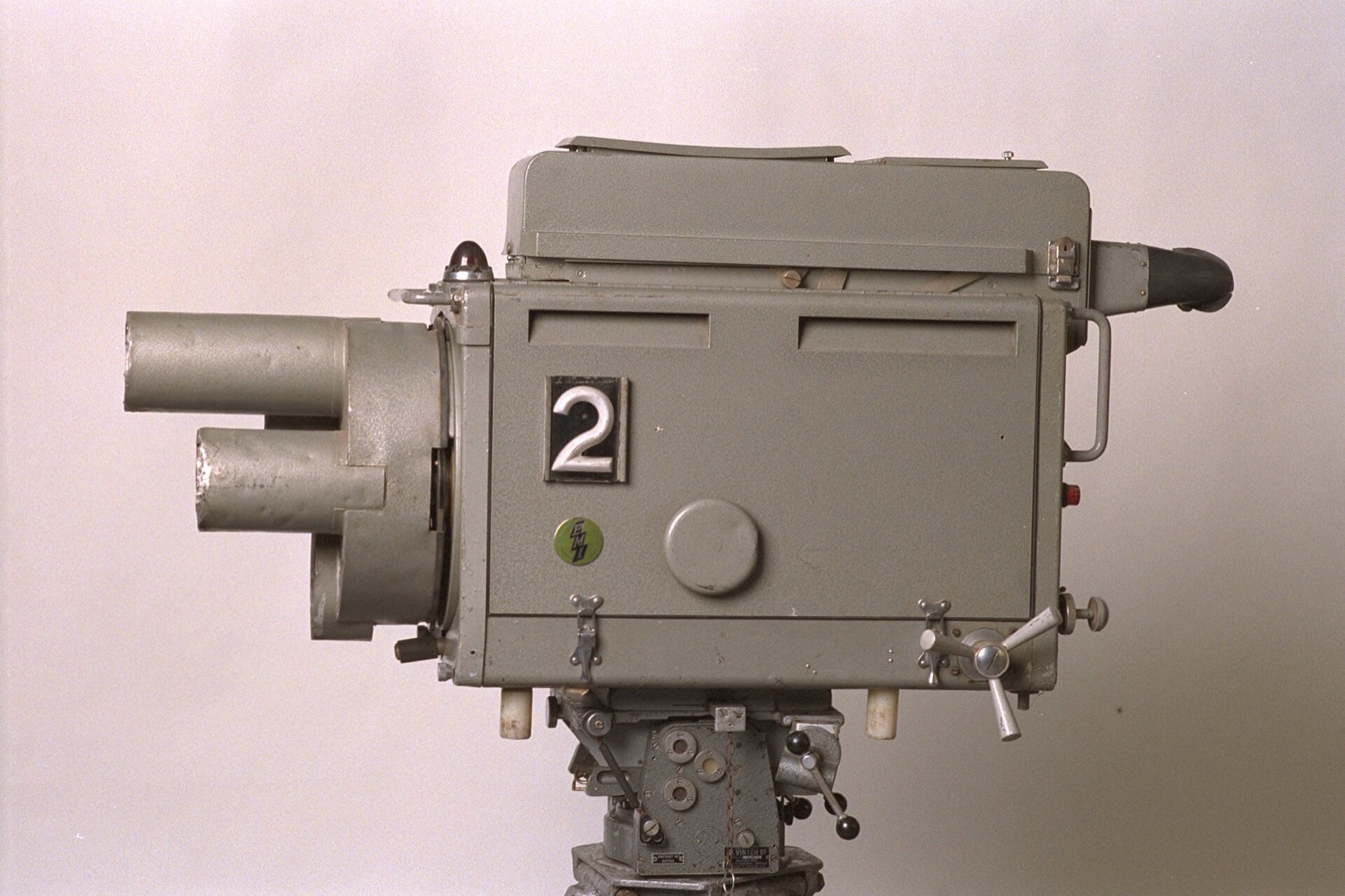 A grey 1950 EMI Emitron television camera head with a large number 2 on its side